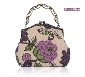 Close-up of handmade bead embroidery with floral patterns and vintage metal handle