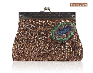 Detail of vintage evening clutch bag featuring peacock feather beadwork and bronze metal clasp