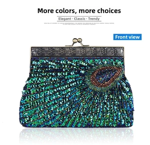 Macro detail of handmade beaded evening bag with peacock feather pattern and bronze clasp