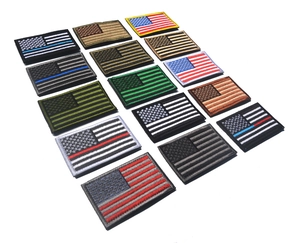 Various embroidered USA flag morale patches in multiple colors on a white background