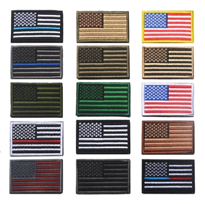 Macro detail of assorted 15-pack USA flag embroidered patches with hook and loop backing