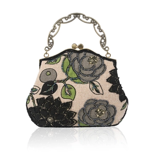Beaded floral linen handbag with vintage bronze frame and elegant metallic handle