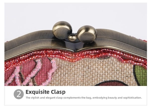 Detail of vintage bronze kiss lock closure and red bead embroidery on linen handbag
