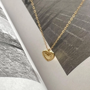 Minimalist 925 sterling silver heart necklace with bow relief in elegant golden finish