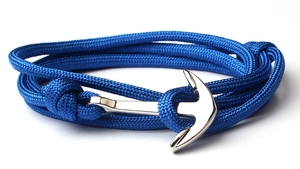 Detail of blue nylon braided rope and silver alloy anchor clasp on nautical bracelet