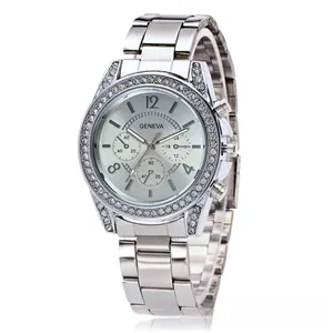 Close-up of silver Geneva watch featuring a diamond bezel and sunburst dial detail