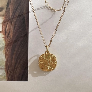Minimalist 925 sterling silver necklace featuring a golden textured square pendant