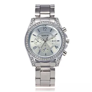 Macro detail of silver Geneva watch with rhinestone bezel and brushed metal dial