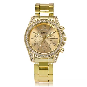 Detail of Geneva gold quartz watch with rhinestone bezel and polished metal link bracelet