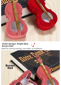 Macro shot of an open violin-shaped jewelry box with soft white velvet interior for rings