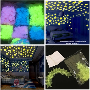 Detailed view of colorful glow-in-the-dark star stickers and square adhesive pads