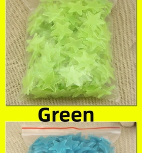 Bulk pack of green and blue star-shaped luminous wall stickers in plastic bags