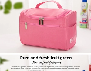 Detail of pink waterproof travel toiletry bag with sturdy handle and double zippers
