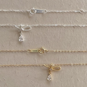 Détails du collier en argent 925 avec pendentif nœud, zircon et fermoir précis