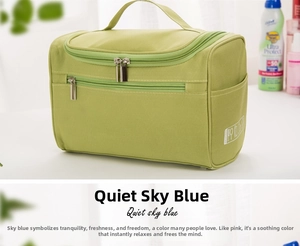 Detail view of camouflage toiletry bag with top handle and double zipper closure
