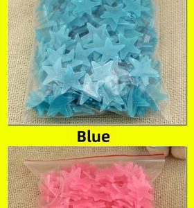 Blue and pink glow in the dark star stickers in clear packaging on beige linen texture