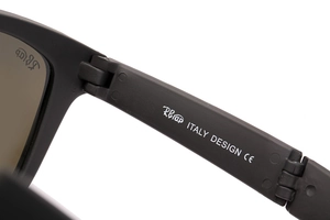 Detail of matte black sunglasses frame hinge with RBap logo and Italy Design CE mark