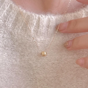 Elegant gold S925 silver necklace with textured round bead pendant on a thin O-chain