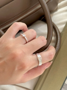 Detailed macro view of S925 silver star pattern ring with vintage textured details
