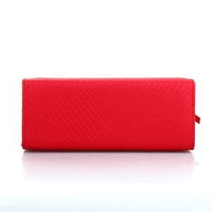 Close-up of red handbag featuring classic V-shaped quilted texture and metal zipper