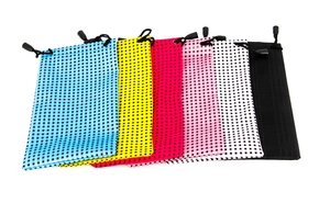 Detail of colorful waterproof eyewear drawstring pouches with black grid patterns