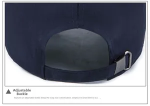 Detail view of the navy canvas baseball cap showing the adjustable dark grey metal buckle