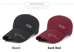 Detail of black and burgundy canvas baseball caps with Sport Mind lettering and long brims