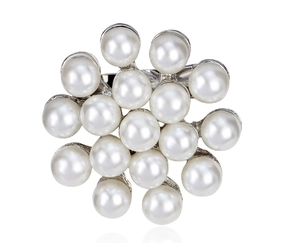 Detail of multi-pearl cluster brooch featuring radiant white pearls on silver plating