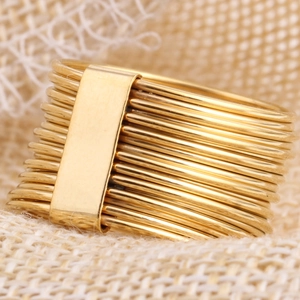 Macro shot of 18K gold plated multi-layer cable ring with stacked band details