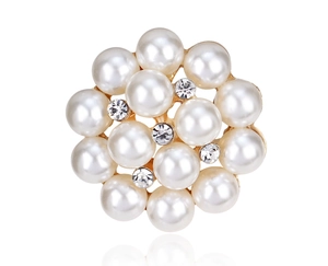 Detail shot of pearl flower brooch with central rhinestones on gold alloy base