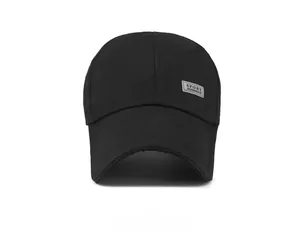 Detailed front view of a black canvas baseball cap featuring a grey sport fabric patch