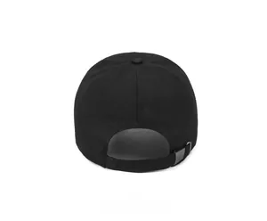Detail of adjustable metal buckle and strap on back of black canvas baseball cap