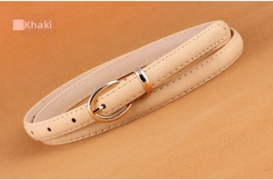 Detailed view of a khaki PU leather skinny belt with a gold-toned metal pin buckle