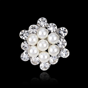 Elegant flower-shaped brooch with white pearls and clear rhinestones on silver metal base