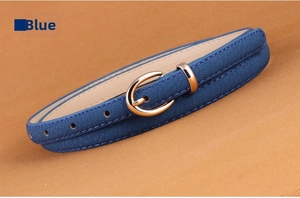 Detail of blue PU leather belt with lychee texture and golden oval pin buckle for women