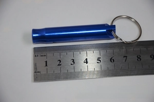 Blue aluminum survival whistle showing a length of 4.5cm on a metal ruler scale