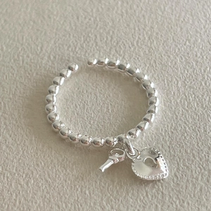 925 sterling silver beaded open ring featuring a hanging heart lock and key charm
