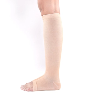 Flesh-colored open-toe knee-high compression socks with breathable knitted texture