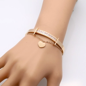 18k rose gold plated bangle with row of diamonds and engraved heart charm
