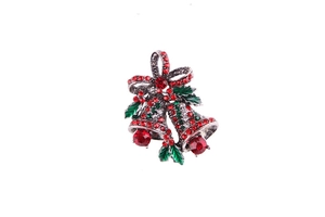 Detail showing vintage gold bells brooch with red and green rhinestones for Christmas
