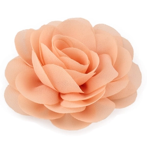 Close-up of peach chiffon flower hair clip showing layered petals and fabric texture
