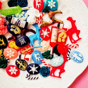 Mix of colorful resin Christmas DIY charms featuring snowflakes, reindeer, and candy canes
