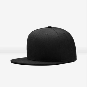 Side view detail of a plain black flat brim baseball cap showing crown profile and seams