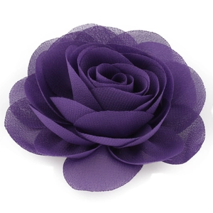 Close-up showing the fiber texture and layered petals of a dark purple chiffon flower clip