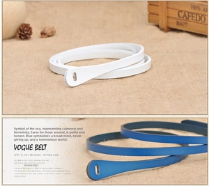 Detailed view of white and dark blue skinny minimalist waist belts for dresses