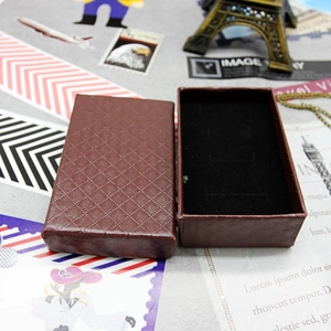 Detail of dark brown diamond-patterned jewelry box with black velvet lining for necklaces