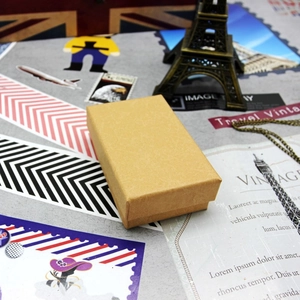 Close-up of vintage kraft paper jewelry gift box with elegant diamond texture pattern