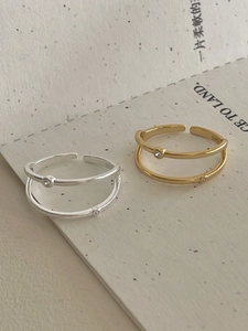 Detail of double-layer S925 sterling silver open rings with sparkling zircon stones
