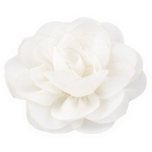 Detailed view of multilayered white chiffon flower petal texture on a hair clip