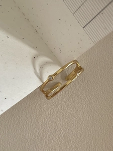 Macro detail of S925 sterling silver gold plated double layer ring with cubic zirconia